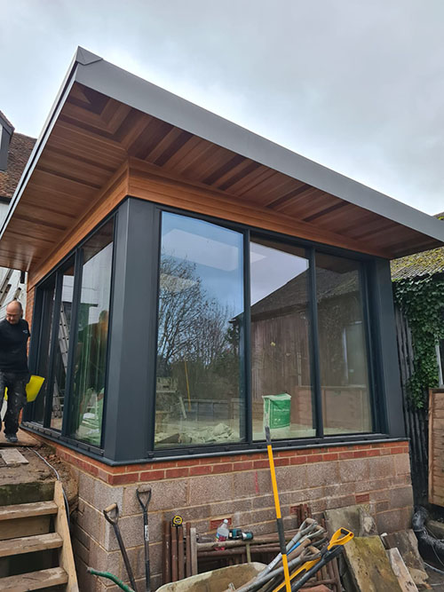 Modern orangery with ceder cladding